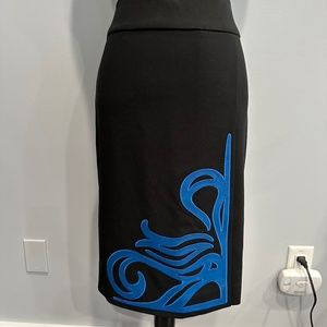 Carlisle black skirt w/royal blue scroll leather appliqué.  Size 6; like new!